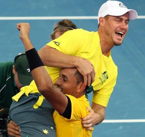 Team captain Lleyton Hewitt, top, celebrates with Nick Kyrgios of Australia after he won his match against Sam Querrey ...