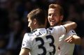 LONDON, ENGLAND - APRIL 15: Harry Kane of Tottenham Hotspur celebrates scoring his sides third goal with Ben Davies of ...