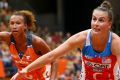 Sydney clash: Serena Guthrie of the Giants and Maddy Proud of the Swifts in action in February.