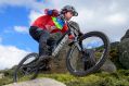 Tim Windshuttle hits a jump with speed on Thredbo's All-Mountain Trail.