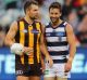   Luke Hodge of the Hawks, talks to Jimmy Bartel of the Cats, after last year's match between the fierce rivals.