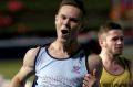 SYDNEY, AUSTRALIA - MARCH 27: Jordan Shelley of NSW celebrates winning the mens 100m under 20s final on day two of the ...