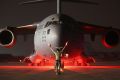 UNSPECIFIED, PERSIAN GULF REGION - JANUARY 09:  A airman guides a U.S. Air Force C-17 Globemaster after it returned from ...