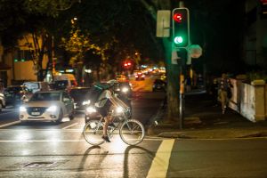 A meal delivery rider on Crown Street in Surry Hills makes a dash through red lights.