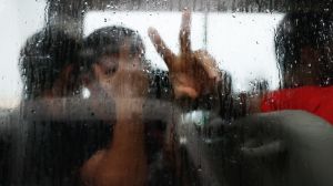 Asylum seekers return to the bus after a visit into town, on Manus Island, Papua New Guinea, on Tuesday 11 April 2017. ...