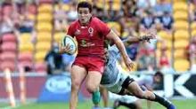 BRISBANE, AUSTRALIA - APRIL 15:  Izaia Perese of the Reds breaks away from the defence during the round eight Super ...