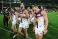 ADELAIDE, AUSTRALIA - AUGUST 06: Brisbane players leave the field lead by captain Tom Rockliff after the round 20 AFL ...