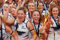 Crows players celebrate during the AFL Women's Grand Final between the Brisbane Lions and the Adelaide Crows on March ...
