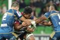 Time out: Lopeti Timani is stopped in his tracks by the Brumbies defence during round eight at AAMI Park.