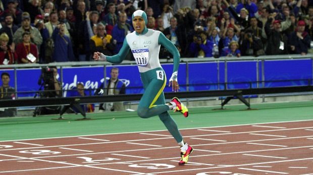 Cathy Freeman wins gold in the 400m at the Sydney Olympics.