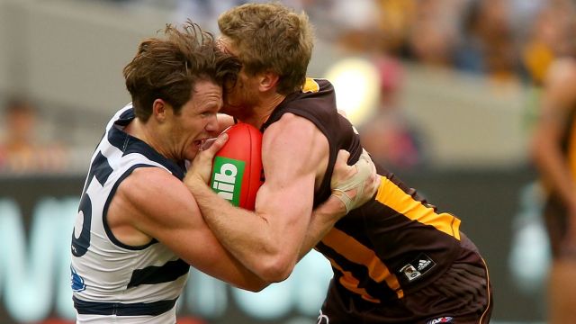 Patrick Dangerfield tackles Ben McEvoy.