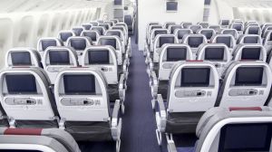 American Airlines Boeing 777-300ER interior, economy class cabin.