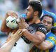 SYDNEY, AUSTRALIA - APRIL 17: David Nofoaluma of the Tigers is tackled during the round seven NRL match between the ...