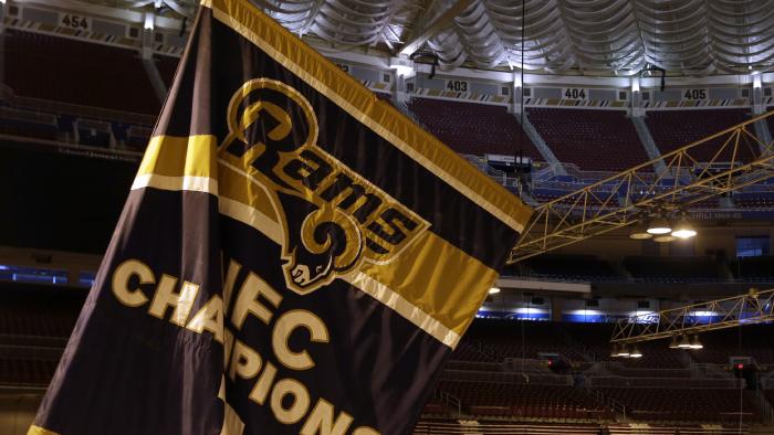 FILE - In this Jan. 14, 2016, file photo, championship banners are removed from the Edward Jones Dome, former home of the St. Louis Rams football team in St. Louis. The city of St. Louis and that region's sports authority are suing the National Football League over the Rams' relocation to Los Angeles. The lawsuit filed Wednesday, April 12, 2017, in St. Louis Circuit Court also names the NFL's 32 teams as defendants and seeks unspecified damages and restitution.(AP Photo/Jeff Roberson, File)