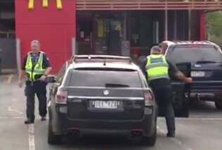 Police leaving a Leongatha McDonald's on Sunday. Picture: Channel 7