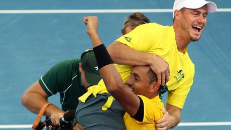 Team captain Lleyton Hewitt, top, celebrates with Nick Kyrgios of Australia after he won his match against Sam Querrey ...