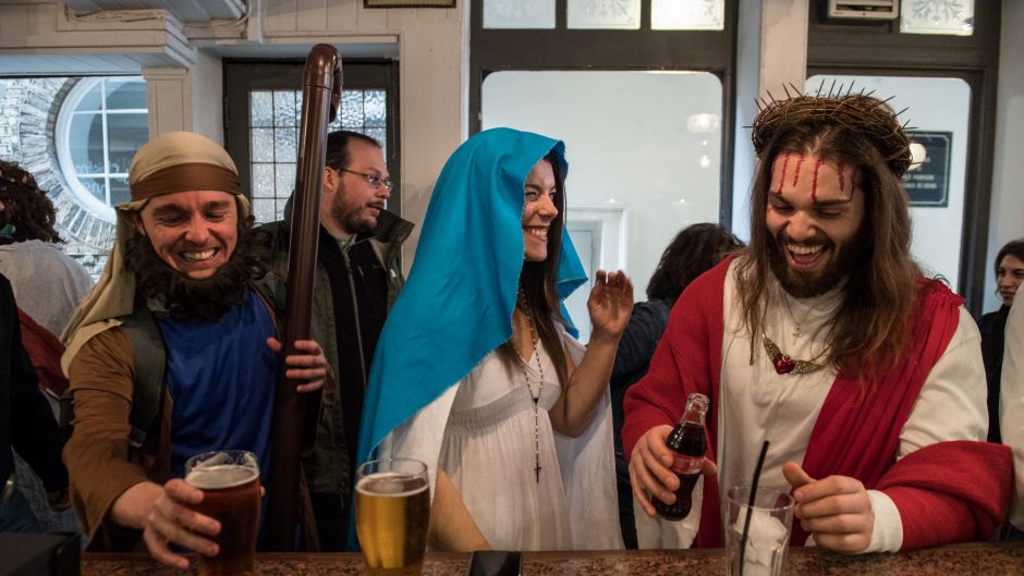  Luigi Pertrilli (R) shares a joke with a woman dressed like the Virgin Mary in the Christopher Inn during the ...