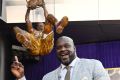 Shaquille O'Neal poses after the unveiling of his statue in front of Staples Center, Friday, March 24, 2017, in Los ...