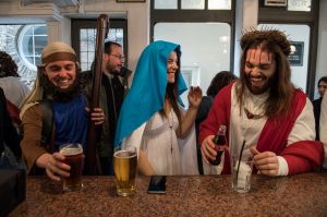  Luigi Pertrilli (R) shares a joke with a woman dressed like the Virgin Mary in the Christopher Inn during the ...