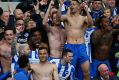 That winning feeling: Brighton and Hove Albion players and fans celebrate promotion.