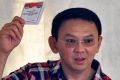 Jakarta Governor Ahok votes in the first round in February.
