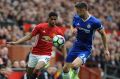 Manchester United's Marcus Rashford (left) is challenged by Chelsea's Gary Cahill.