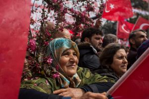 TRABZON, TURKEY - APRIL 08: A woman listens to Kemal Kilicdaroglu, leader of the CHP (Republican People's Party) speak ...