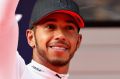 Polesitter Lewis Hamilton waves to the crowd after qualifying in Shanghai. 