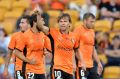 Brett Holman of the Roar celebrates scoring a goal against the Wellington Phoenix at Suncorp Stadium.