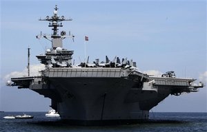 U.S. aircraft carrier USS Carl Vinson is anchored off Manila Bay as it begins its four-day port call Sunday May 15, 2011 with three other warships in the Philippines.