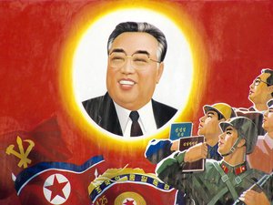 A propaganda poster with Kim Il-sung's official portrait