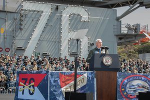 Vice President Mike Pence addresses service members on the flight deck of the Navy’s forward-deployed aircraft carrier, USS Ronald Reagan in Yokosuka, Japan, April 19. 2017.