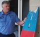 Authorities are inspecting the mauled surfboard to determine the species of shark involved in the fatal attack. 