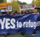 Church leaders and others take part in the pro-refugee rally on Palm Sunday.