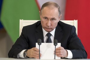 ussian President Vladimir Putin attends a meeting with Uzbek President Shavkat Mirziyoyev in Moscow's Kremlin, Russia, Wednesday, April 5, 2017.