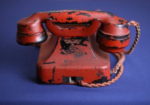 An engraving of a swastika and Adolf Hitler's name are seen on the back of Hitler's personal traveling telephone at Alexander Historical Auctions in Chesapeake City, Md.