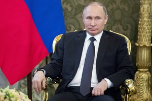 Russian President Vladimir Putin listens to Uzbek President Shavkat Mirziyoyev, during a meeting in Moscow's Kremlin, Russia, Wednesday, April 5, 2017. Mirziyoyev is in Russia on an official visit.