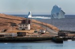 The large iceberg is visible from the shore in Ferryland, an hour south of St. John's, Newfoundland . More icebergs have ...