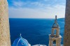 Panagia Portaitissa monastery viewed from a window of Querini's Venetian Castle, Astypalea Island, Greece.After taking ...