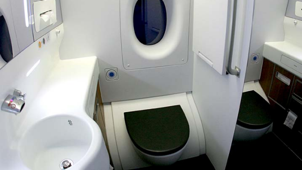 Tight squeeze ... a toilet on board a Qantas A380. A US manufacturer has come up with a new design that will shrink plane toilets even further.