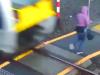 Distracted woman walks into path of speeding train