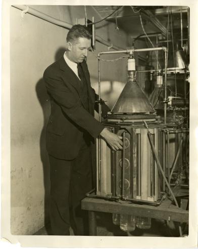 Dr. Johnston, with plant physiology equipment.