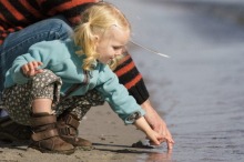 2.5 year old toddler enjoying the late summer at the beach with her dad. generic outdoors nature father young daughter ...