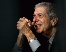 Leonard Cohen Listens to partner Anjani Thomas sing to thousands of people, while taking a seat at the back of the stage during a free concert on Saturday, May. 13, 2006 in Toronto, Ont.
(CP PHOTO/Nathan Denette)