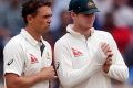 Steve O'Keefe, left, talks with Test captain Steve Smith in Ranchi, India last month.