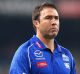 PERTH, AUSTRALIA - APRIL 22: Brad Scott, coach of the Kangaroos walks to the changerooms after being defeated during the ...