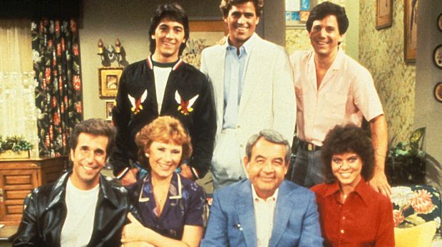 The cast of Happy Days . The Fonz - Henry Winkler , Chachi - Scott Baio , Joanie - Erin Moran , Howard Cunningham - Tom ...
