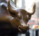 <em>Charging Bull</em> and <em>Fearless Girl</em> face off against each other in New York.