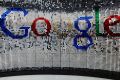 A sign featuring Google Inc.'s logo stands inside the entrance to their new President-elect Donald Trump's sit down with ...