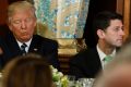 US President Donald Trump sits with House speaker Paul Ryan during a "Friends of Ireland" luncheon on Capitol Hill  on ...